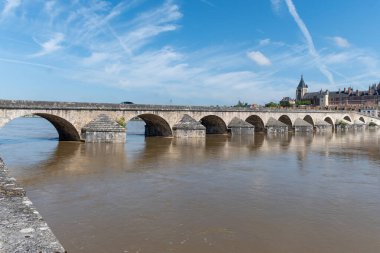 Views of houses, bridge and castle in old part of town of Gien is on the Loire river, in Loiret department, France clipart