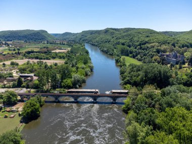 Aerial view on Dordogne river near Beynac-et-Cazenac rocky village located in Dordogne department in southwestern France clipart