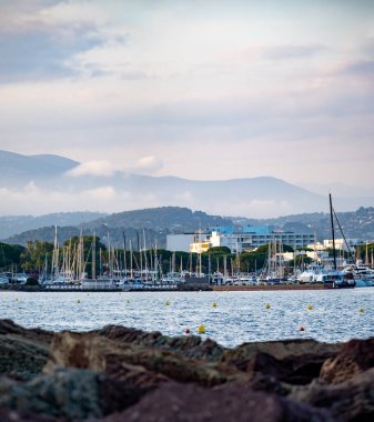 Coastline with stones, bays, castle in Mandelieu-la-napoule near Cannes, French Riviera, France in summer clipart