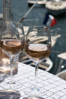 Glasses of cold rose gris Cote de Provence wine in yacht harbour of Port Grimaud, summer vacation on French Riviera in Provence, France, wine tasting clipart