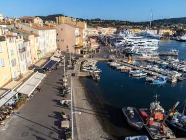 Aerial view on boats, yachts and old port of famous Saint-Tropez town at sunset on French Riviera, Var, Provence, France, summer vacation destination clipart