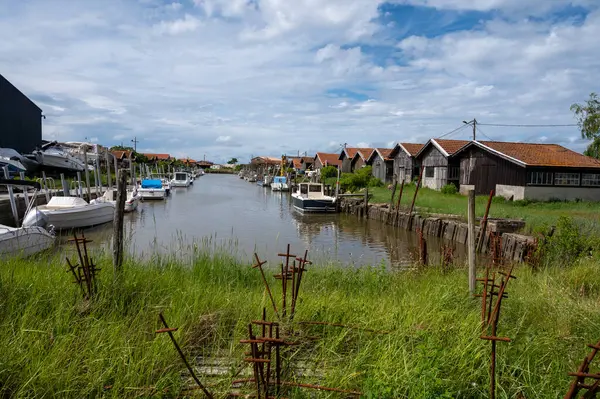 stock image Travelling in France, old wooden huts and oysters farms in Gujan-Mestras village, cultivation, fishing and sale of fresh oysters seashells, Arcachon bay, Atlantic ocean, France, tourists destination