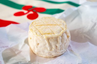 Cheese collection, soft sheeps milk brebis French cheese with mold produced on cheese farm in Basque Country in France and towel with Basque symbols and colours clipart