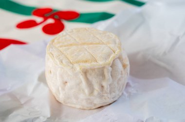 Cheese collection, soft sheeps milk brebis French cheese with mold produced on cheese farm in Basque Country in France and towel with Basque symbols and colours clipart