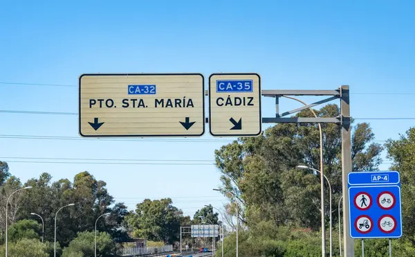 stock image Driving car or family camper in summer, road signs and directions Sevilla, Jerez, Cadiz, no traffic jam on touristic road in Andalusia, Spain