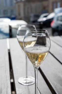 Tasting of brut and reserve grand cru champagne sparkling wine produced by traditional method in Mesnil-sur-Oger in Champagne, France, close up clipart