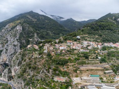 Colourful view on Italian Riviera and blue Mediterranean Sea from French-Italian border in Grimaldi village, Ventimiglia near San-Remo, travel destination, panoramic view, houses and gardens clipart