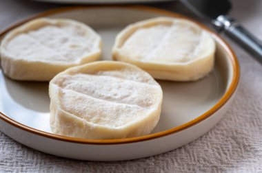 Rocamadour or cabecous soft goat AOC cheese with soft rind produced on farm in Perigord and Quercy on farmers market, departement Lot in France clipart