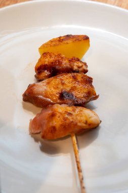 Typical snacks of Basque Country, pinchos or pinxtos skewers with small pieces of bread, fish, sea food, sweet green pepper served in bar in San-Sebastian or Bilbao, Spain, close up clipart