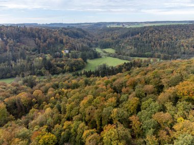 Aerial view on Mullerthal in autumn, Luxembourg's Little Switzerland, hiking routes, rock formations, moss-covered forests, tourist destination in Europe clipart