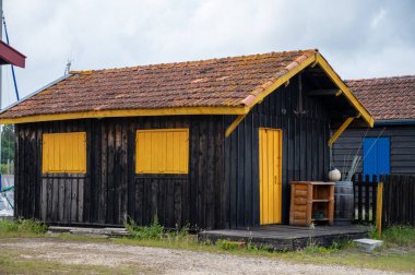 Travelling in France, old wooden huts and oysters farms in Gujan-Mestras village, cultivation, fishing and sale of fresh oysters seashells, Arcachon bay, Atlantic ocean, France, tourists destination clipart