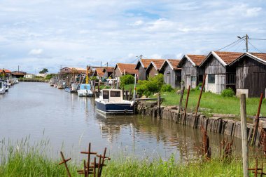 Travelling in France, old wooden huts and oysters farms in Gujan-Mestras village, cultivation, fishing and sale of fresh oysters seashells, Arcachon bay, Atlantic ocean, France, tourists destination clipart