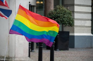 Gay pride rainbow colours flag outdoor on streets of London, UK clipart