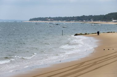 Panoramic view on Arcachon Bay, near Passe Sud and Nord, Bank d'Argun, Dune du Pilat and Cap Ferret, on rainy winter day, tourist destination on Atlantic ocean, France clipart