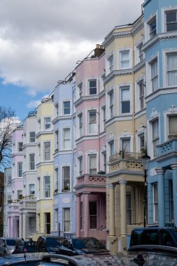 Touristic route on Notting Hill, walking on streets with colourful houses, Portobello road, city life, wealthy neighbourhoods in London, UK in spring clipart