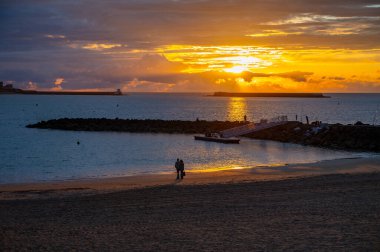 Ciboure and Saint-Jean-de-Luz bay and sandy beach on Basque coast on sunset, famous resorts, known for beautiful architecture, nature and cuisine, South of France, Basque Country clipart