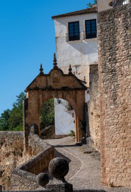 Walking in Ronda, touristic town in Andalusia, Pueblo Blanco white village, Spain. Historical buildings, walls and fortress. clipart