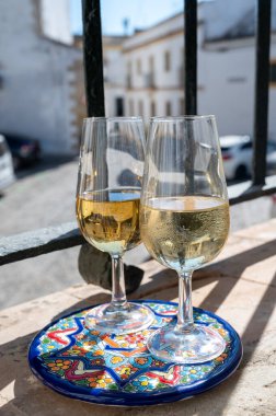 Sherry fino, manzanilla, olorosso wine, jerez fortified wine made from palomino white grape served in andalusian house in old part of Jerez de la Frontera, Cadiz, Andalusia, Spain clipart