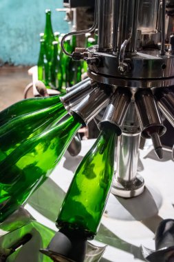 Degorgement manual process in caves, old equipment, traditional method of production of cremant sparkling wine in south part of Luxembourg country on bank of Moezel, Mosel river. Wine tour. clipart