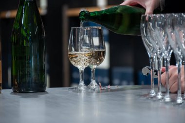 Tasting of sparkling white wine, traditional champagne method making of cremant in caves on Moselle river valley in Luxembourg, wine tour and visiting caves clipart