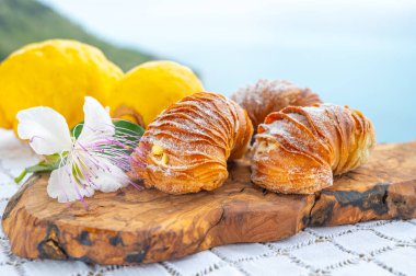 Italian desssert, Naples sfogliatella, shell-shaped layered pastry, with sweet custard-like filling made with semolina, ricotta, and candied lemon citrus fruit clipart