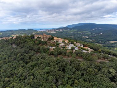 Landscape of French Riviera from above, view on hills, houses and green vineyards Cotes de Provence, production of rose wine near Saint-Tropez, Gassin, Pampelonne beach, Var, France in summer clipart