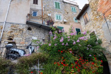 Colourful view on Italian Riviera and blue Mediterranean Sea from French-Italian border in Grimaldi village, Ventimiglia near San-Remo, travel destination, panoramic view, houses and gardens clipart