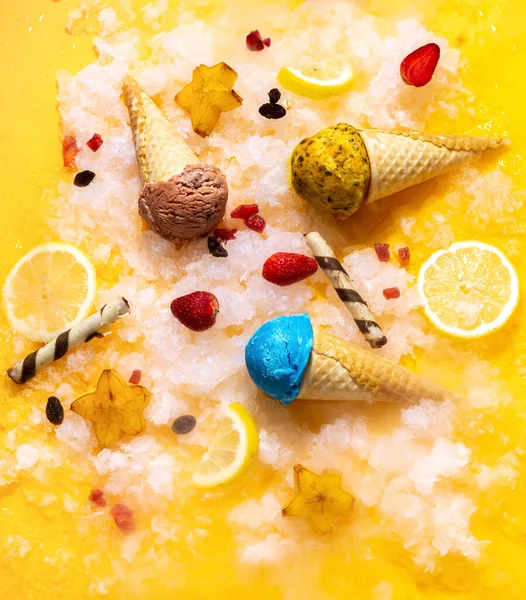 stock image Colorful ice cream cones with fruits on a yellow background. Summer vibe. Conceptual Photography. Top view. For background.