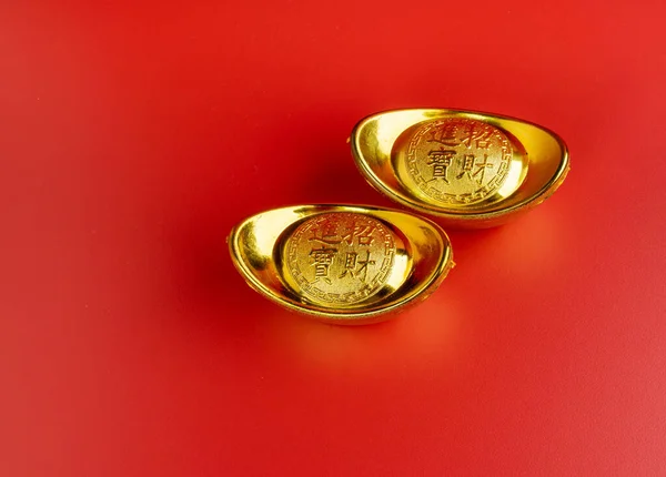 Happy Chinese New Year. Chinese Gold Sycee. Isolated red. Copy space. Usable for wallpaper, greeting card, design.
