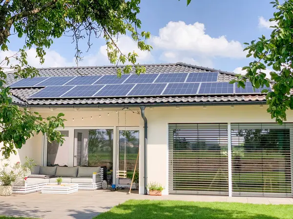 Solar photovoltaic panels on house roof. Modern country house with self-sustaining energy system