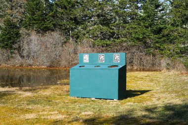 Recycling Bin for Waste Sorting in a Canadian Nature Reserve clipart