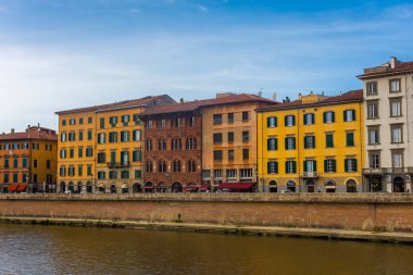 Pisa, Italy, 14 April 2022: View of the colorful banks of Arno river