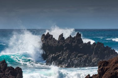Powerful waves against the sea stacks of Lanzarote island, Atlantic Ocean, Canary Islands, Spain