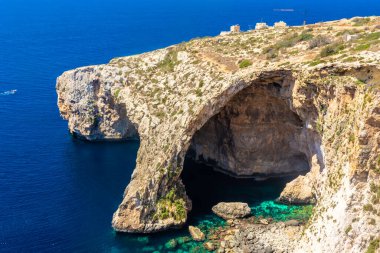 The Blue Grotto of Malta, rock formation on the sea with crystal clear water