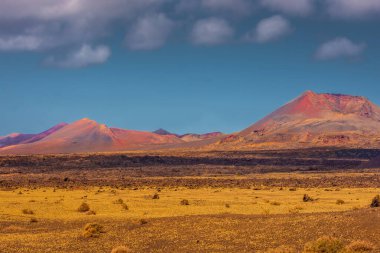 Wild volcanic landscape of Los Volcanes Natural Park in Lanzarote, Canary Islands, Spain