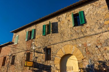 Monteriggioni, Italy, 17 April 2022: historic center of the medieval town at sunset