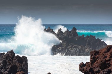 Powerful waves against the sea stacks of Lanzarote island, Atlantic Ocean, Canary Islands, Spain