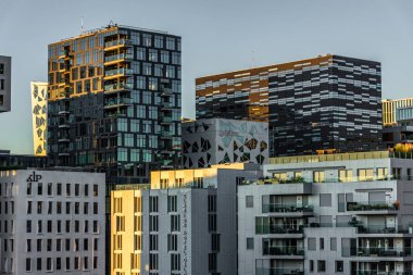 Oslo, Norway, 7 August 2022: modern architecture in Oslo business district at sunset