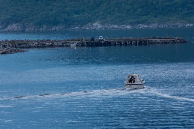 Gryllefjord, Norway, 17 August 2022: Boat in the harbor of Senja