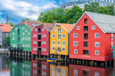 Trondheim, Norway, 11 August 2022: colorful buildings on the canal of Trondheim