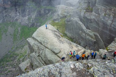 Odda, Norway, 8 August 2022: Long queue to get a photo over Trolltunga, the famous tourist spot