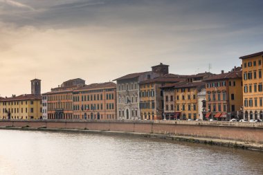Pisa, Italy, 14 April 2022: View of the colorful banks of Arno river
