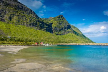The crystal clear water of the Ersfjordstranda beach in Senja Island, Norway