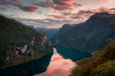 Sunset over the Geirangerfjord and the Seven Sisters Waterfall, Norway