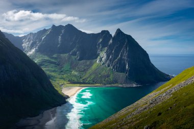 View over the turquoise water of Kvalvika Beach from Ryten Mount, Lofoten Islands, Norway