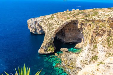 The Blue Grotto of Malta, rock formation on the sea with crystal clear water