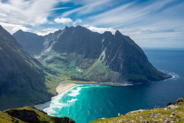 View over the turquoise water of Kvalvika Beach from Ryten Mount, Lofoten Islands, Norway