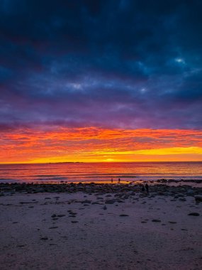 Dramatic midnight sunset with amazing colors over Uttakleiv beach on Lofoten Islands, Norway