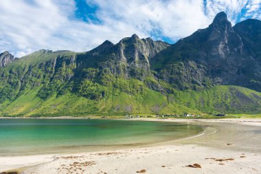 The crystal clear water of the Ersfjordstranda beach in Senja Island, Norway