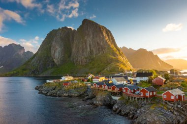 Beautiful sunrise over Hamnoy, fishermen village with the typical red houses of the Lofoten Islands, Norway